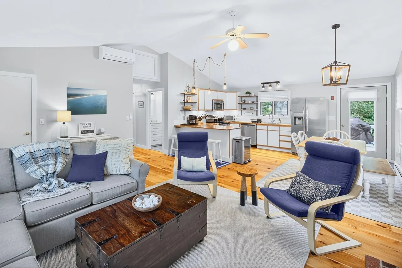 Open living room and kitchen at Cherrystone vacation rental in Eastham
