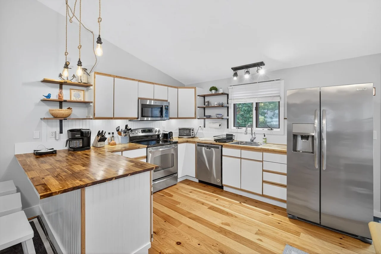 Kitchen with stainless steel appliances and a peninsula