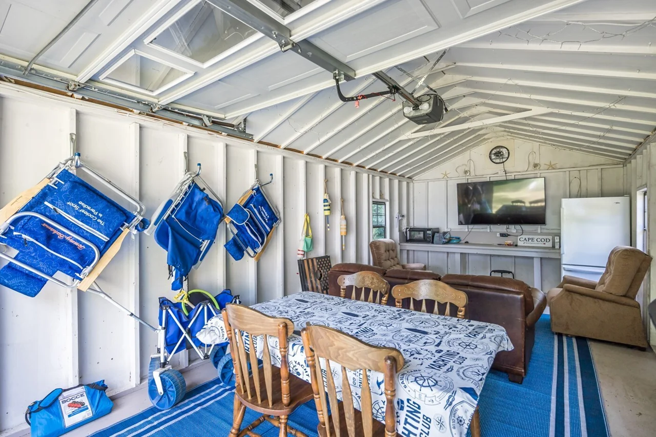 Game shed with beach chairs and a beach cart